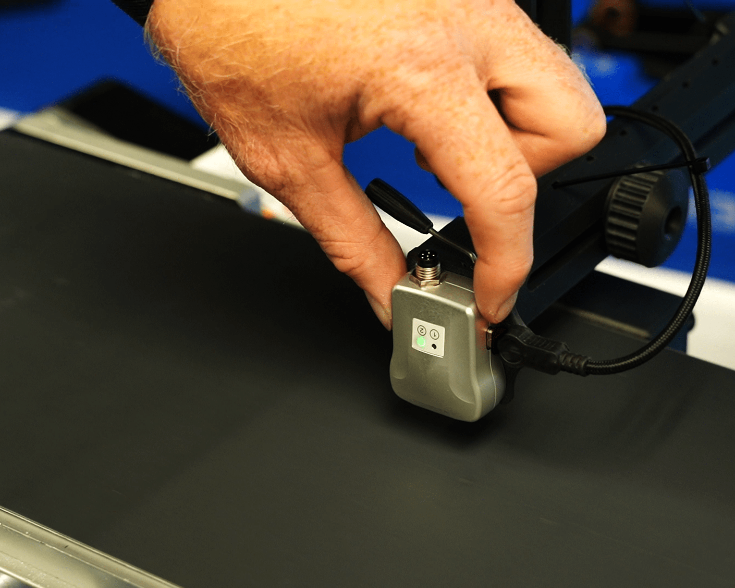 LP1 on conveyor with hand-1-min