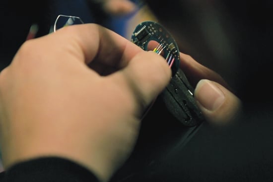 hands-wiring-encoder-closeup_550x367