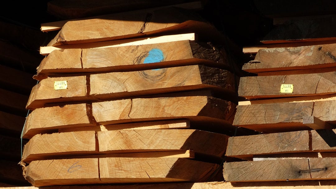 stacked-logs-sawn-into-dimensional-lumber