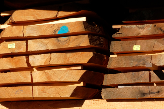 timber_stacked-logs-sawn-into-dimensional-lumber_550x367